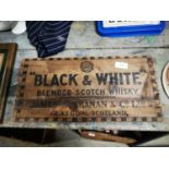 Black and White Scotch Whiskey wooden advertisement.