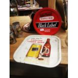 Two beer advertising drinks trays.