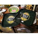 Two Carlberg drink's trays