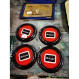 Four tinplate Black Label advertising ashtrays.