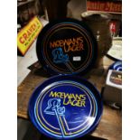 Two McEwan's Lager drink's trays