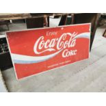 Enjoy Coca Cola advertising sign.