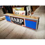 Harp Lager hanging light up sign.