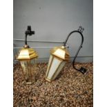 Two brass pub lanterns on original bracket.