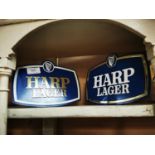 Two Harp counter display advertising signs.