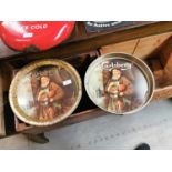 Two Carlsberg tinplate advertising drinks' trays.