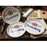 Three Furstenberg advertising drinks trays.