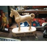 White Horse Scotch Whisky advertising figure.