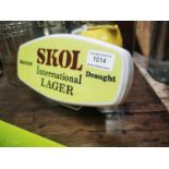 Skol International Lager advertising shelf light.