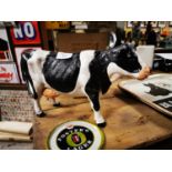 Cast iron model of a Freisen cow.