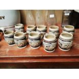 Collection of ten German stoneware beer mugs.