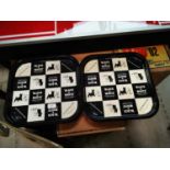 Two Black and White tinplate advertising trays.