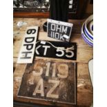 Collection of old car number plates.