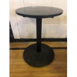 Granite topped circular restaurant café table with wrought iron base of geometrical design W 55cm