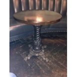 Circular hardwood table with decorative cast iron base W 60cm H 72cm