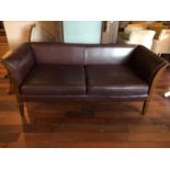 Leather upholstered settee W 180cms H 77cms 80 D 80 cms