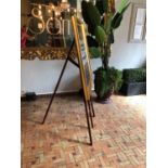 Easel complete with framed gold advertisement W 75cm H 150cm