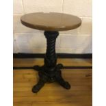 Circular hardwood restaurant table with decorative cast iron base W 48cm H 71cm