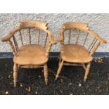 Pair of 19th century elm smokers chairs, with metal support on arms
