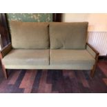 A walnut framed settee with green fabric W 180cms H 110cms D 80cms