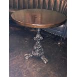 Circular hardwood table with decorative cast iron base W 60cm H 72cm