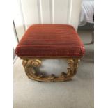 Carved wood and gilt stool with striped orange fabric