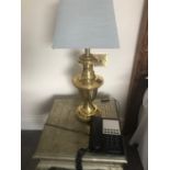 A pair of brass tapering lamps complete with shades