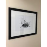 Black and white framed print of a bird on a log