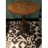 Hardwood circular top restaurant table on decorative cast iron base W 60cm H 75cm