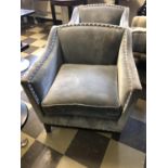 Pair of grey upholstered chairs with large chrome button embellishment W 76cm H 78cm