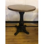 Circular hardwood restaurant table with decorative cast iron base W 58cm H 72cm
