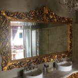 Monumental carved wood and gilt mirror with floral decoration throughout W 245cm H 175cm
