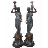 Pair of bronze figurines of ladies with urns