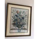 Framed coloured print of a floral display