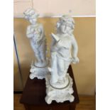 Pair of white porcelain cherubs W 24cm H 67cm