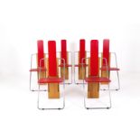 Six red metal and wood chairs. '70s