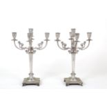 Two chiseled silver candelabra, gr. 1930 ca.
