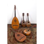 Five mandolins. 19th century. Defects