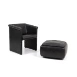 Black leather armchair with pouf. '70s. Defects