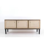 Three-door sideboard in imitation leather. '60s