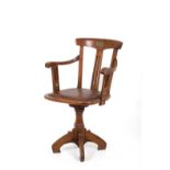 Swivel study armchair in walnut. Early XX century