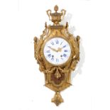 Cartel clock in chiseled and gilt bronze