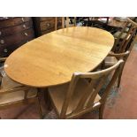 1970S TEAK NATHAN OVAL DROP FLAP GATE LEG ACTION DINING TABLE AND FOUR CHAIRS