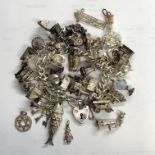 SILVER HEART SHAPED CHARM BRACELET AND LOOSE CHARMS INCLUDING POSTBOX, FISH, TRAIN, KEYS AND CHURCH,
