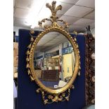 19TH CENTURY ORNATE GILTWOOD OVAL MIROR WITH FEATHER PLUME CRESTING 95CMH X55CM W