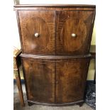 20TH CENTURY MAHOGANY AND LINE INLAID BOW FR0NTED DRINKS CABINET.