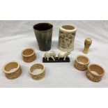 A HORN BEAKER,CANTONESE IVORY CARVED POT, CARVED BONE AND FAUX IVORY NAPKIN RINGS,