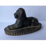 CAST METAL RECUMBENT LION DESK PAPERWEIGHT ON OVAL RIDGED BASE