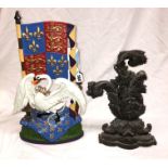 CAST IRON ACANTHUS SCROLL DOORSTOP AND COLD PAINTED HERALDIC DOORSTOP AND A 20TH CENTURY REGENCY