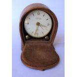 A LEATHER CASED LOOPING 8 DAY AUTOMATIC TRAVELLING CLOCK -SWISS MADE